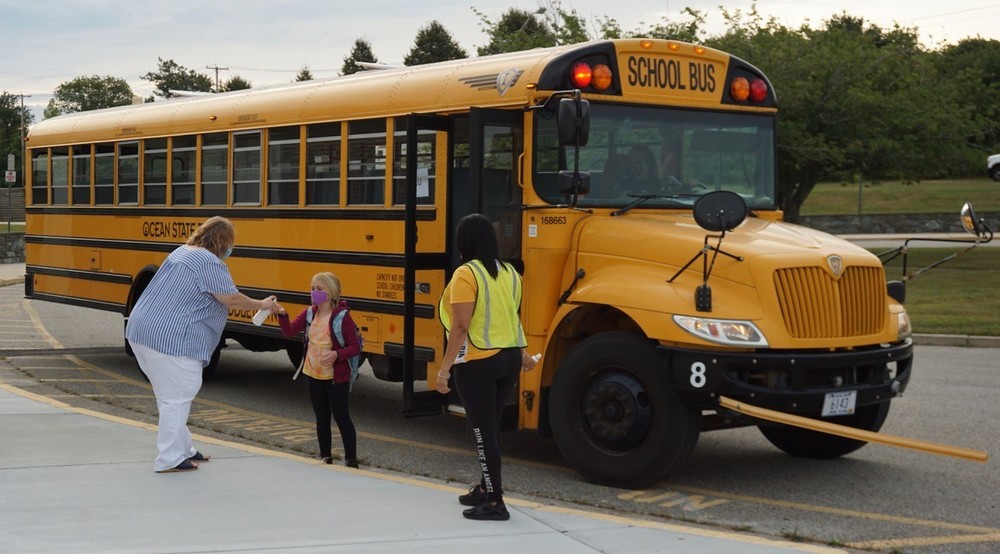 Gr 4 student exits bus at Gaudet